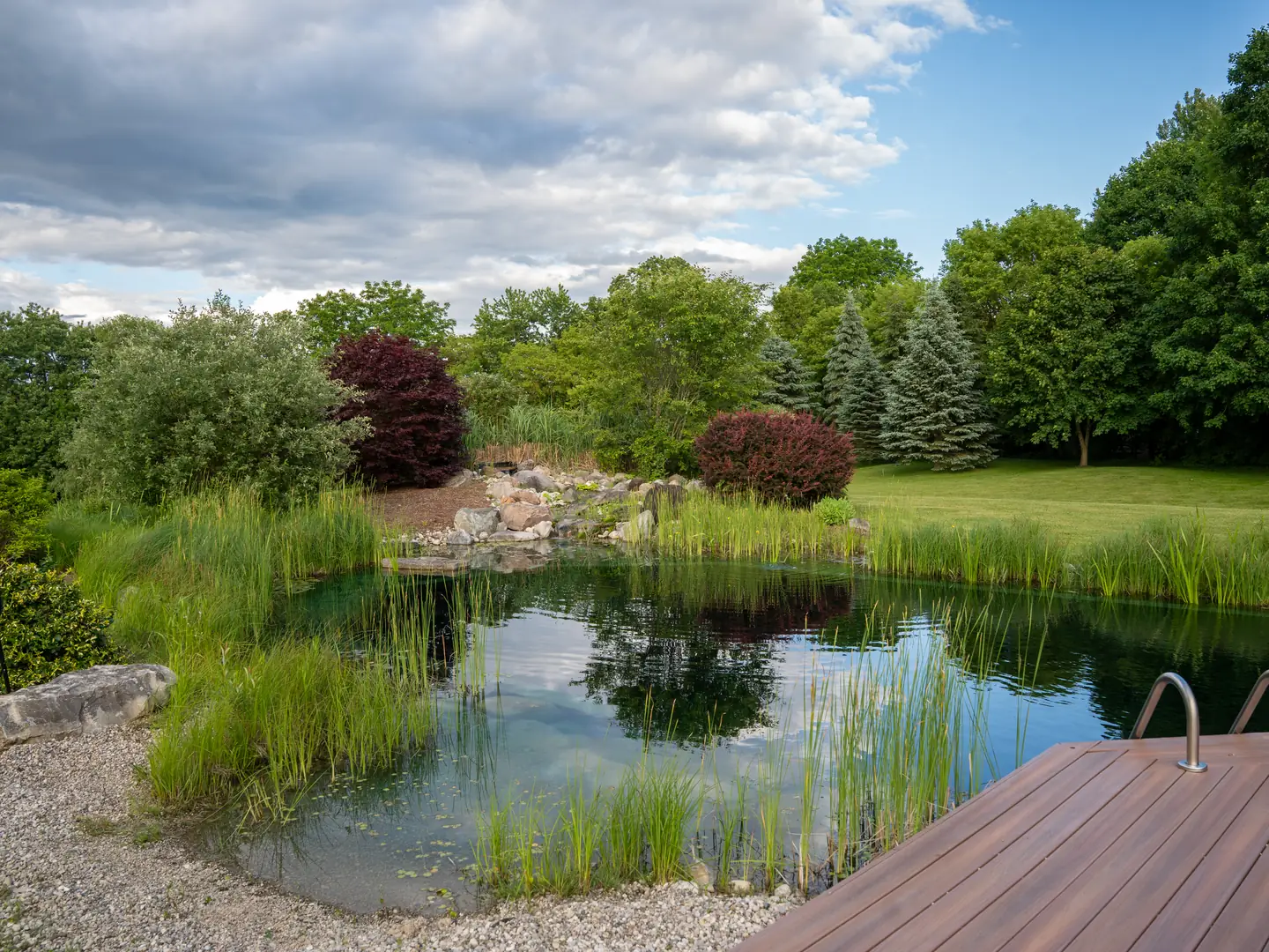 Natural pool and its rock border seen from the timber deck