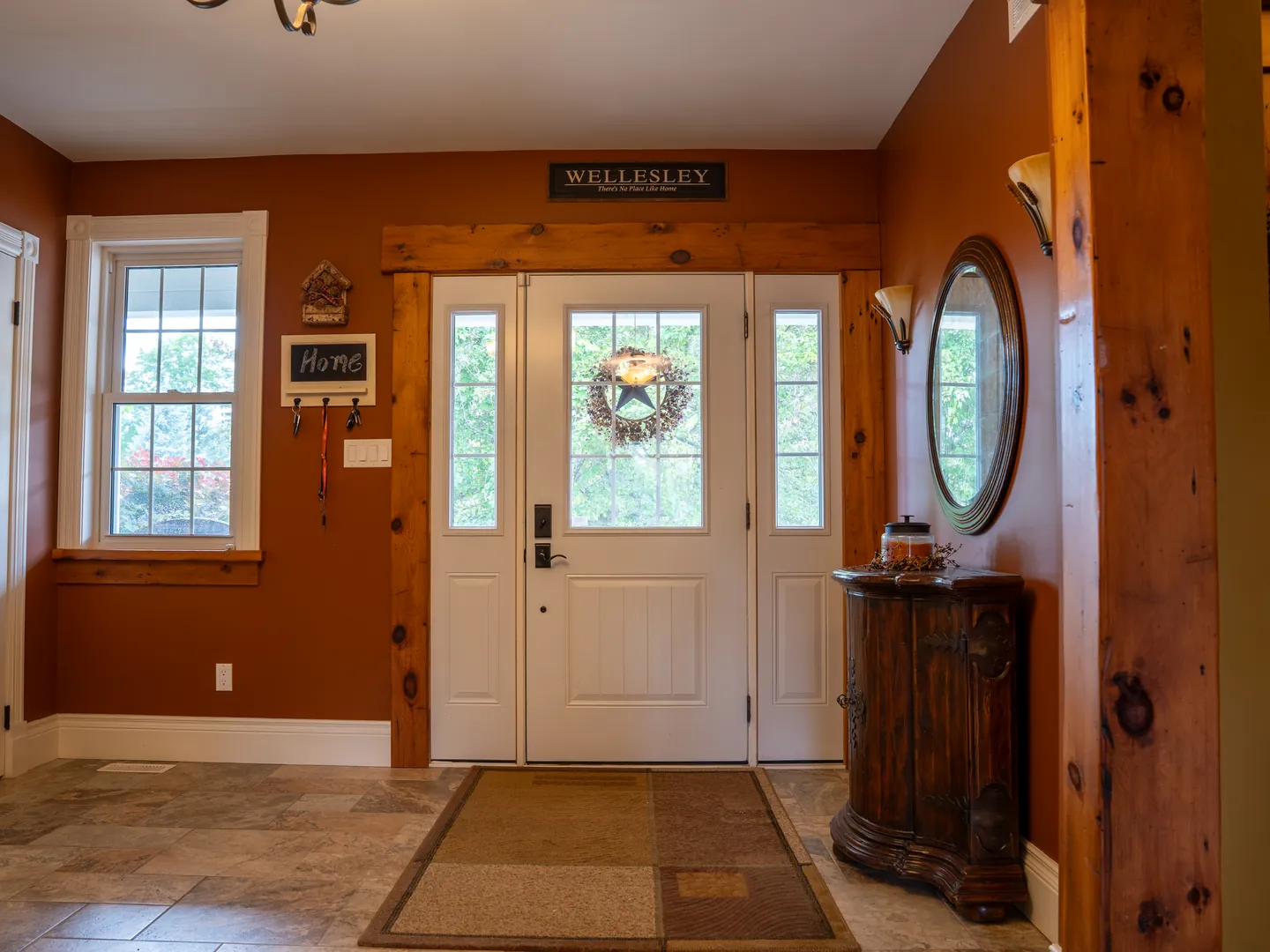 Warm-toned entry with timber posts and front door